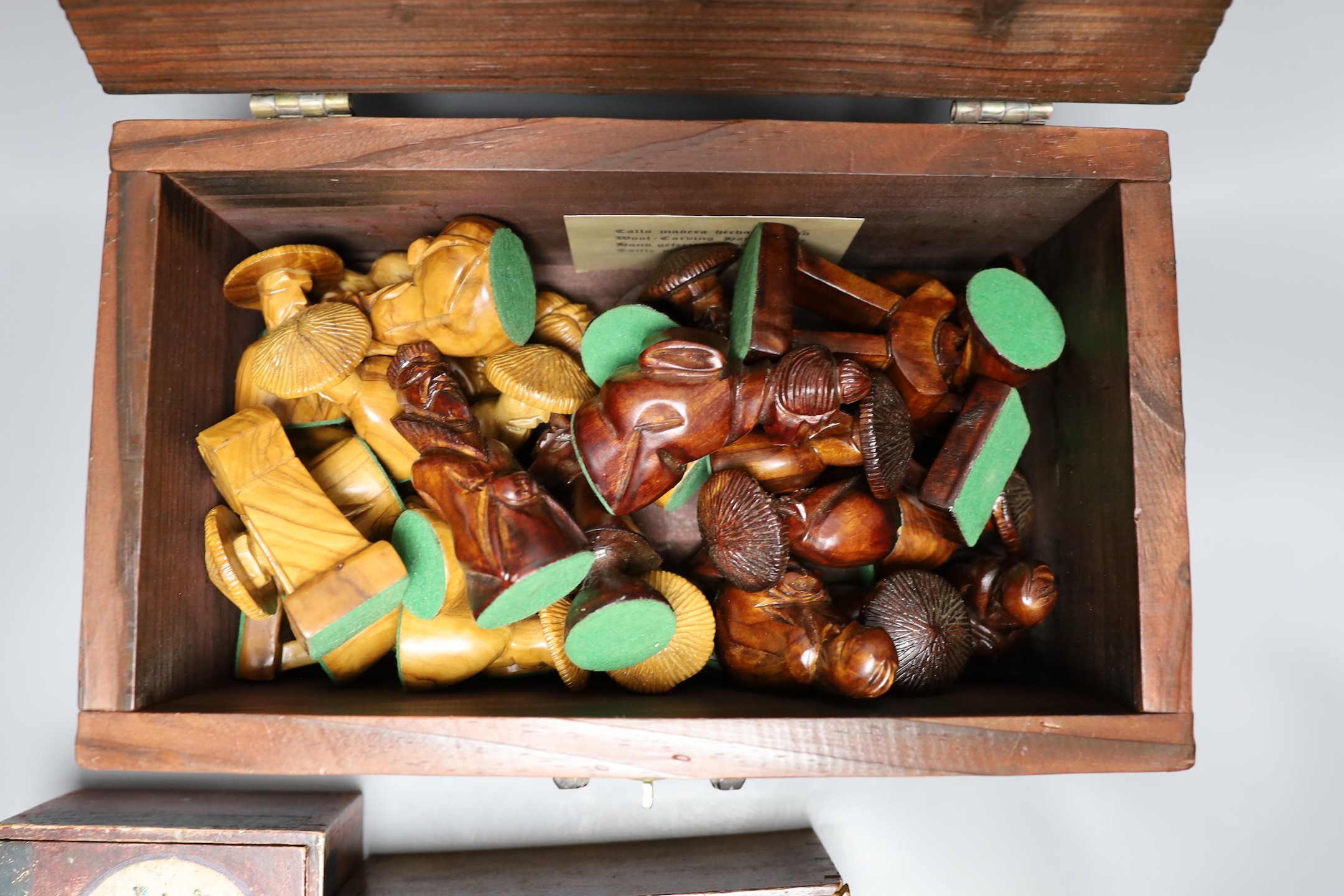 A Chinese carved wood chess set in carved mahogany box, together with three others and a dominoes set